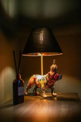 a lamp in the shape of a dog on a table at Trendy 2 Bed Flat - Near Airport in Broxburn