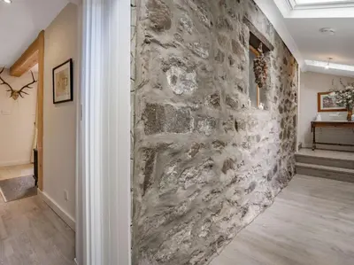 a stone wall in the hallway of a home at 1 Bed in Callander oc-pe173 in Strathyre
