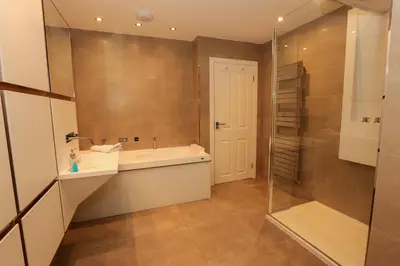 a bathroom with a sink and a shower at Viewpoint Villa - Luxury 4 Bedroom villa with elevated views in Rothesay