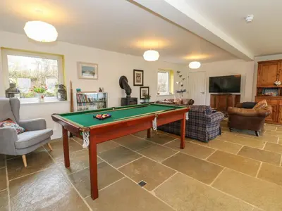 a living room with a pool table in it at The Pier House in Lochgilphead