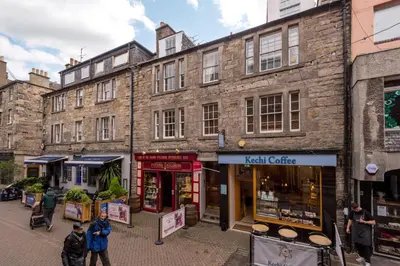 a group of people standing in front of buildings at Rose Apartment in Edinburgh