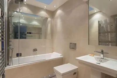 a bathroom with a tub and a sink and a toilet at Prime Edinburgh City Centre - 4 Bed Penthouse in Edinburgh
