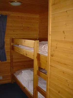 a couple of bunk beds in a cabin at Loch Lomond Lodge in Rowardennan