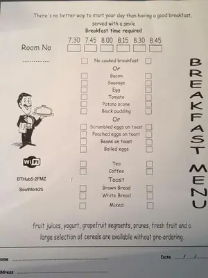 a receipt with a cartoon of a man holding a pizza at Southfork Villa Guesthouse in Callander