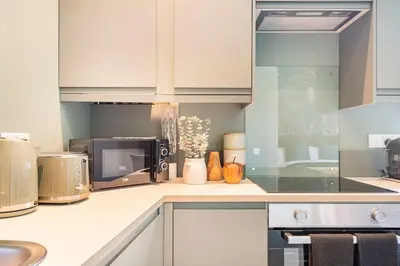 a kitchen with a microwave and a counter top at Boutique Home Stay - Bliss Studio in Paisley