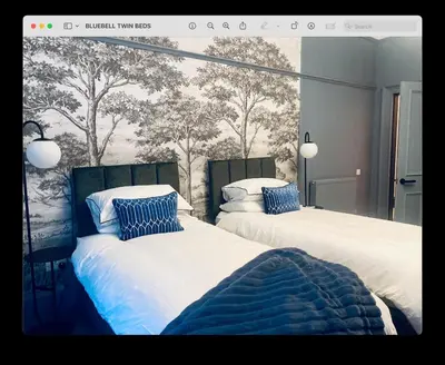 two beds sitting next to each other in a bedroom at Bluebell Studio Glasgow Airport in Paisley