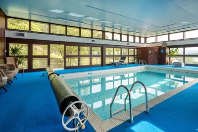 a large swimming pool with a cannon in the middle at Loch View House in Kilfinan