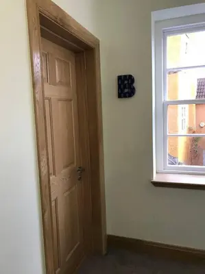 an empty room with a door and a window at Luxury Flat, 20 Minutes by train from Edinburgh in Inverkeithing