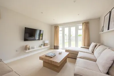 a living room with a couch and a coffee table at Luxury Detached Home in Edinburgh