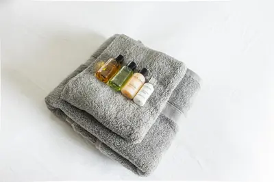 a gray towel with two medicines and two batteries at Luxury Detached Home in Edinburgh