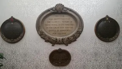 a plaque on a wall with words on it at Royal Scots Club in Edinburgh