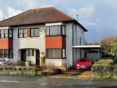 a house with a red car parked in front of it at 1930s 3Bed House in Quiet Village w/ Large Garden in Bishopton