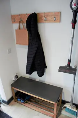 a black tie hanging on a wall next to a table at Tigh Na Beithe in North Ballachulish