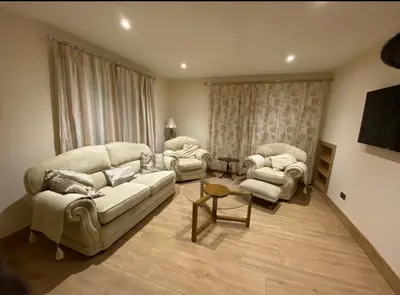 a living room with a couch and two chairs at The Annex at Meeks Park immaculate 2 bed in Alloa