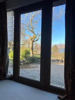 a window with a view of a tree outside at Fuaim Na Mara, The Sound Of The Sea. in Fort William