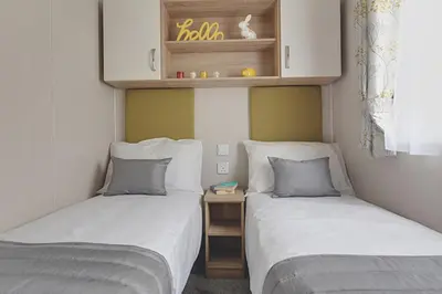 two beds in a small room with at Campsie Glen Holiday Park in Glasgow
