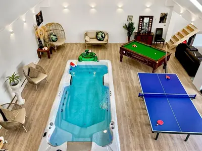 an overhead view of a pool and ping pong table at Island Seaview Villa in Rothesay