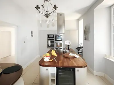 a kitchen with a wooden counter top in a room at Island Seaview Villa in Rothesay