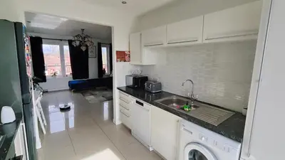 a white kitchen with a sink and a dishwasher at La Casita, Your Home Away from Home - Free Parking in Glasgow