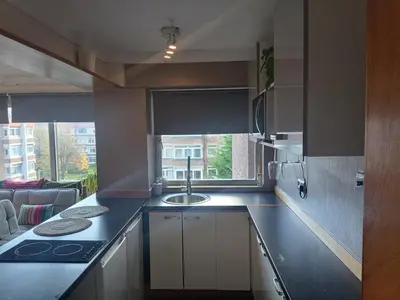 a kitchen with a sink and a counter top at Open space studio in Shawlands in Glasgow