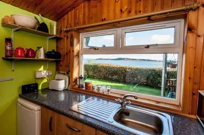 a kitchen with a sink and a window at Seaview Cottage in Isle of Jura
