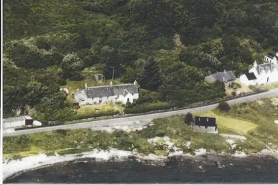 an aerial view of a house and a road at Seaview Cottage in Isle of Jura