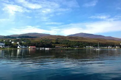 a view of a body of water with mountains in the background at Seaview Cottage in Isle of Jura