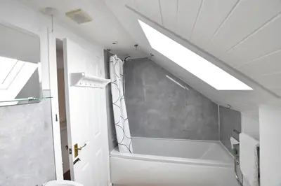 a bathroom with a shower and a bath tub at Argyll House Ben More in Salen