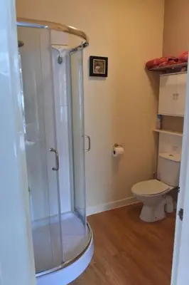a bathroom with a shower and a toilet at Argyll House Burnside in Salen