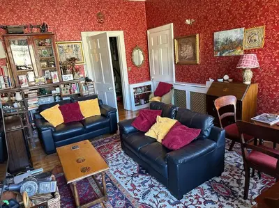 a living room with two couches and a table at Very central 2 bedroom flat in World Heritage Site in Edinburgh