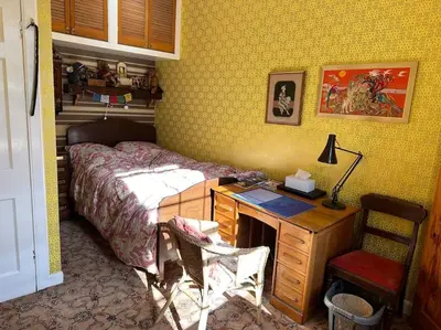 a bedroom with a bed and a desk with a desk at Very central 2 bedroom flat in World Heritage Site in Edinburgh