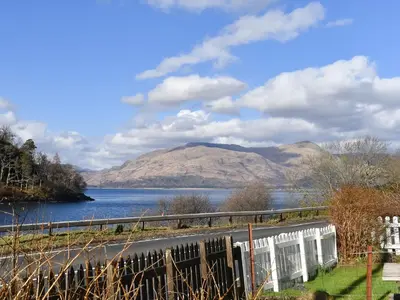 a view of a lake with mountains in the background at Bayview in Kentallen