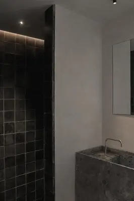 a bathroom with a shower and a sink and a mirror at Loggia Studio in Edinburgh