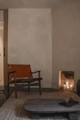 a living room with a bench and a fire place at Loggia Studio in Edinburgh