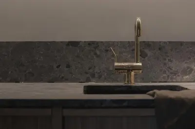 a kitchen sink with a faucet on a counter at Loggia Studio in Edinburgh