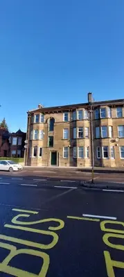 an empty street in front of a building at Paisley Pattern Flat West End UWS UNI GLA Glasgow Airport in Elderslie
