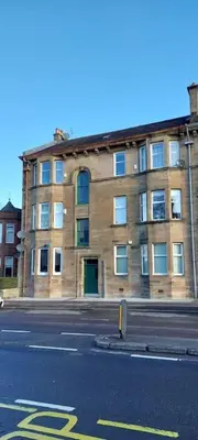 a building on the side of a city street at Paisley Pattern Flat West End UWS UNI GLA Glasgow Airport in Elderslie