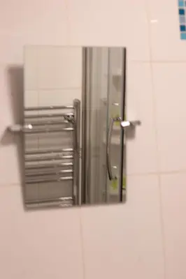 a mirror on a wall in a bathroom at 3 Bedrooms Flat in Central Edinburgh Old Town Sleeps 6 in Edinburgh