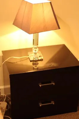 a lamp sitting on top of a black dresser at 3 Bedrooms Flat in Central Edinburgh Old Town Sleeps 6 in Edinburgh