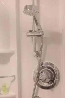 a metal washer and dryer in a refrigerator at 3 Bedrooms Flat in Central Edinburgh Old Town Sleeps 6 in Edinburgh