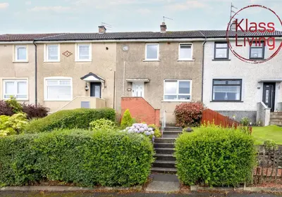 a house with bushes and stairs in front of it at Aitkenhead house by Klass Living in Coatbridge