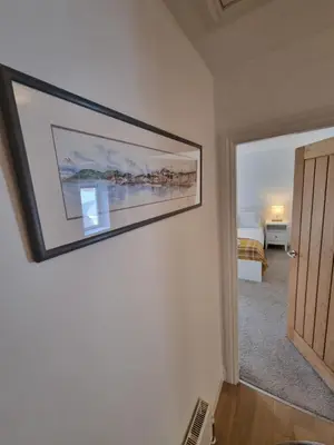 a painting hanging on a wall in a room at Oban Lorne Apartment in Oban