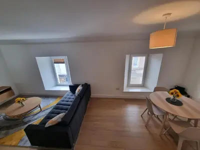 a living room with a couch and a table at Oban Lorne Apartment in Oban