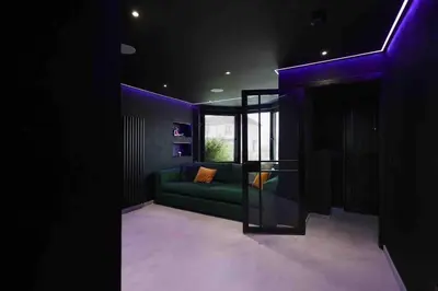 a living room with a green couch and a window at Luxury Couples Get-Away Glasgow in Knightswood