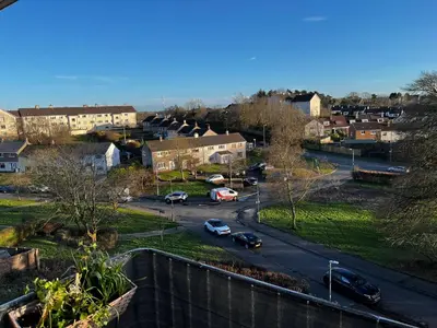 a view of a city with cars parked on a street at Scottish Nest in the heart of East Kilbride 10mins from Hairmyres Hospital in East Kilbride