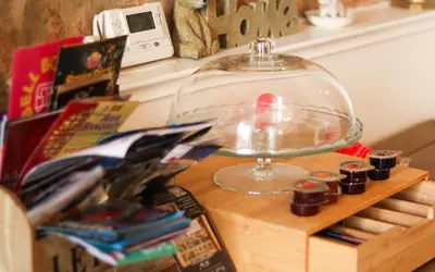 a glass bowl on top of a wooden table at 1 Bedrooms Flat in Central Edinburgh Haymarket, Heart of Edinburgh Flat Sleeps 4 in Edinburgh