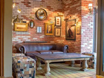a living room with a couch and a table at Busby Hotel in Busby