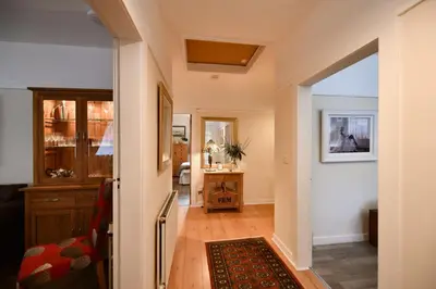 a hallway of a home with a living room at Ladyland Cottage in Maybole in Maybole