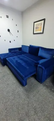 a blue couch sitting in a living room at Stylish home in Linlithgow Near Edinburgh Airport Free parking Free WiFi in Linlithgow