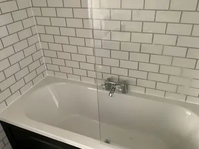 a white bath tub with a silver faucet at Pirnmill Home with a view in Pirnmill